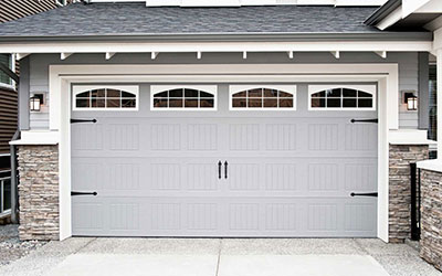 How do you lubricate a garage door?