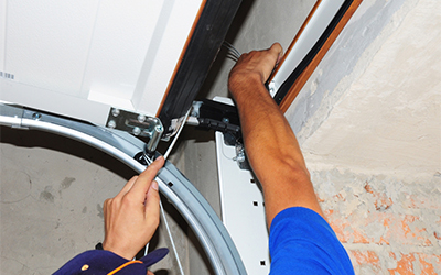 How to Tighten Garage Door Hardware Before It Becomes a Problem