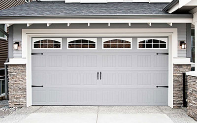 How do you lubricate a garage door?